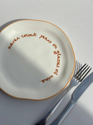 MÆGEN - Statement Plate - 'never count years of glasses of wine.'